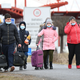Ukrainian refugees cross the border by foot in Barabas, Hungary, on February 28, 2022.